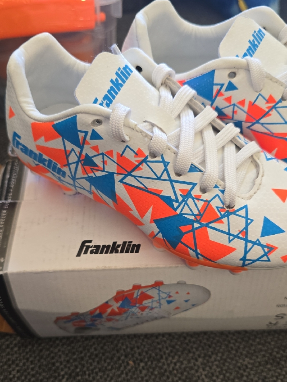 Kids White Soccer Cleats with Blue & Orange Graphic